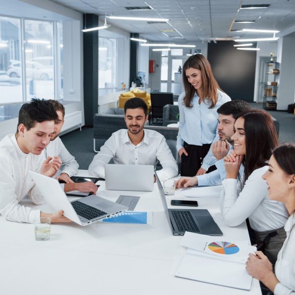 showing-good-results-group-young-freelancers-office-have-conversation-smiling_146671-13633